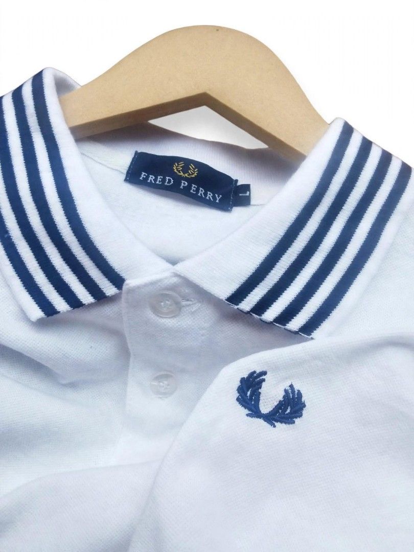 Fred Perry White Polo Shirt Size L (Category: Tshirts & Polo Shirts ) located in Digos. Submitted by echooo123 (Listing ID 1469237752, Image 2). Description: WTS: FRED PERRY POLO SHIRT💎 Size: Medium Dimes: 20x26 Good Condition Issue: remove washtags Need wash only Affordable Solid over all Cr: 9.7/10 DM: 📥.