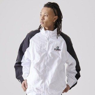 FUBU Since 1992 Black and White Windbreaker Jacket (Category: Coats, Jackets and Outerwear) located in Manila. Submitted by starbalesukandjapansurplus (Listing ID 1469195569, Image 1). Description: - Brand: FUBU - Color: White with black sleeves - Design: Zip-up front, high collar, and branded tape down shoulders and sleeves - Details: Embroidered chest logo, small red logo tab at the back collar - Fit: Relaxed fit with elasticated cuffs and hem 