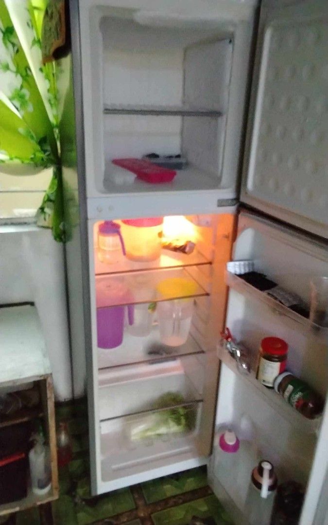 Fujidenzo Two Door Refrigerator Silver (Category: Refrigerators and Freezers) located in Quezon City. Submitted by aezie (Listing ID 1469380719, Image 1). Description: - Brand: Fujidenzo - Type: Two-door refrigerator - Color: Silver - Condition: Excellent working condition, clean inside and out - Features: Top freezer with shelf, adjustable glass shelves, bottom vegetable crisper, and door bins for bottles and jars - Availability: Ready for picku