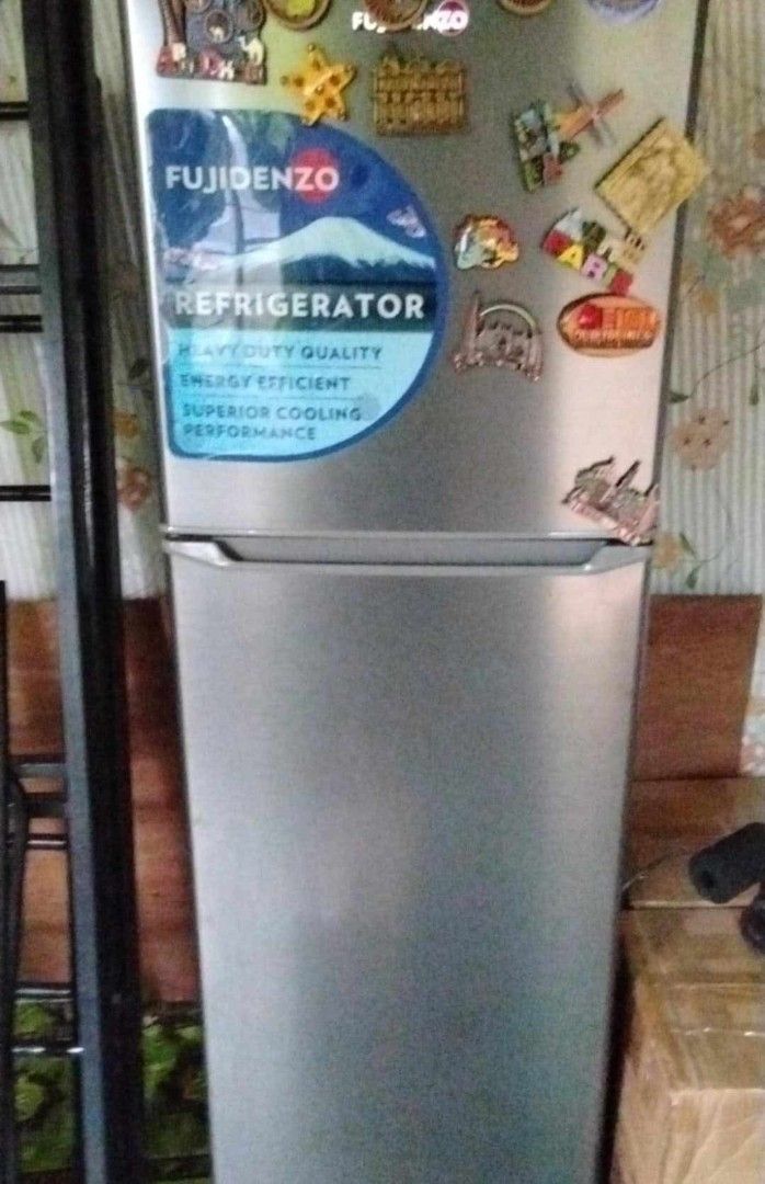 Fujidenzo Two Door Refrigerator Silver (Category: Refrigerators and Freezers) located in Quezon City. Submitted by aezie (Listing ID 1469380719, Image 2). Description: - Brand: Fujidenzo - Type: Two-door refrigerator - Color: Silver - Condition: Excellent working condition, clean inside and out - Features: Top freezer with shelf, adjustable glass shelves, bottom vegetable crisper, and door bins for bottles and jars - Availability: Ready for picku