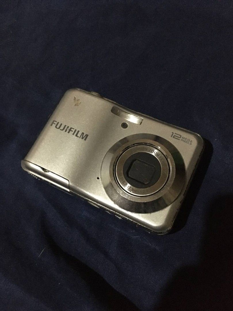 Fujifilm 12 Megapixels Digital Camera (Category: Cameras) located in Quezon City. Submitted by livkatecooke (Listing ID 1469369494, Image 1). Description: - Model: Fujifilm Compact Digital Camera (Silver) - Resolution: 12 Megapixels with built-in Fujinon zoom lens - Display: Standard rear LCD screen with easy navigation and playback controls - Design: Pocket-friendly, lightweight, and compact body style - Condition: Worn Out, selling for parts an