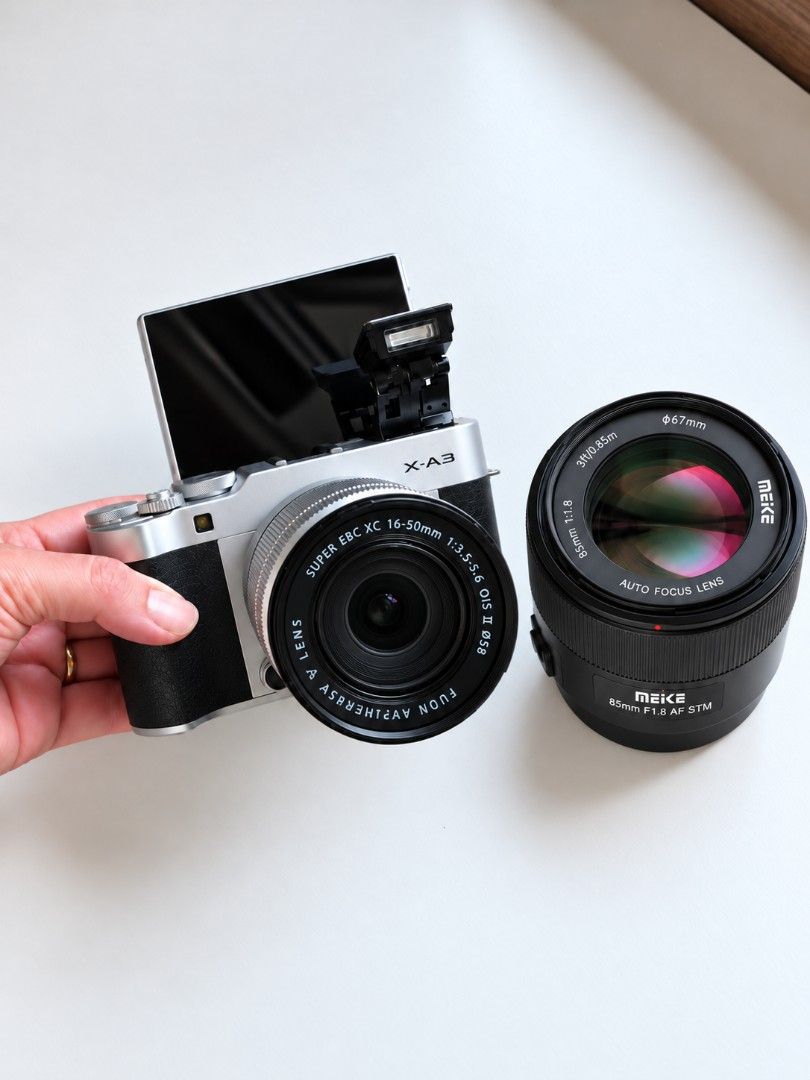 Fujifilm X-A3 Mirrorless Camera with Two Lenses (Category: Cameras) located in Taguig. Submitted by pepitoshinnnn (Listing ID 1469170474, Image 1). Description: - Camera: Fujifilm X-A3 body in sleek silver and black - Kit Lens: Fujinon XC 16-50mm f/3.5-5.6 OIS II zoom lens - Bonus Lens: Meike 85mm f/1.8 autofocus lens (great for portraits) - Key Features: Flip-up touchscreen LCD for selfies and built-in pop-up flash - Perfect for: Everyday shooti