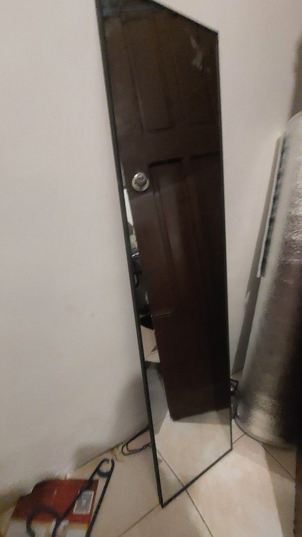 Full length rectangular wall mirror with dark frame (Category: Mirrors) located in Manila. Submitted by ceej3951899538 (Listing ID 1469288972, Image 2). Description: - Type: Long rectangular wall mirror - Frame: Sleek dark border - Condition: Clean, spotless glass surface - Features: Ready to hang, perfect for hallway or bedroom - Use: Ideal for daily outfit checks.