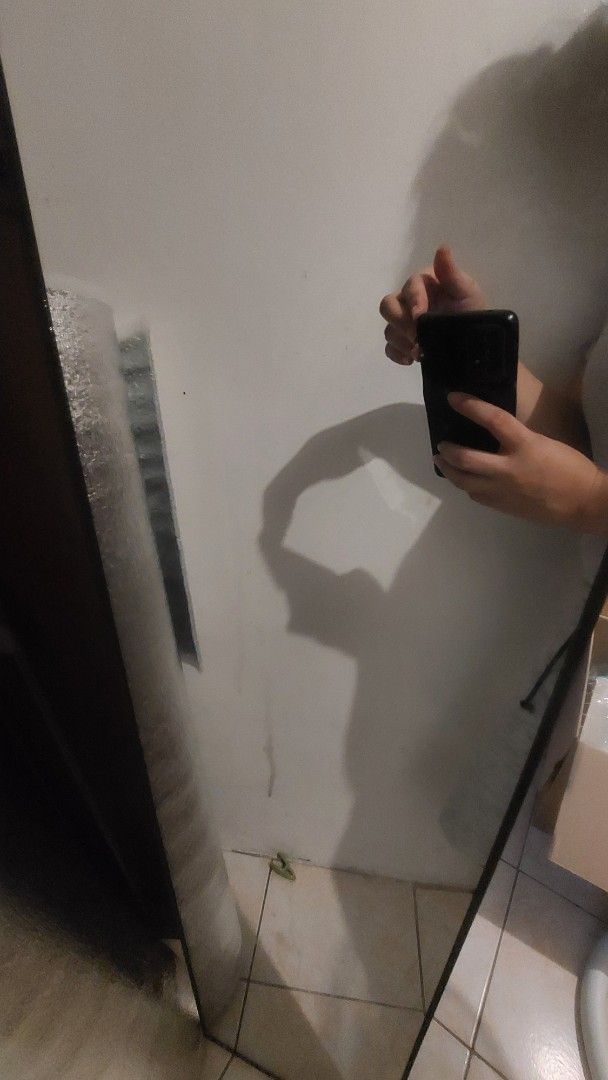 Full length rectangular wall mirror with dark frame (Category: Mirrors) located in Manila. Submitted by ceej3951899538 (Listing ID 1469288972, Image 1). Description: - Type: Long rectangular wall mirror - Frame: Sleek dark border - Condition: Clean, spotless glass surface - Features: Ready to hang, perfect for hallway or bedroom - Use: Ideal for daily outfit checks.