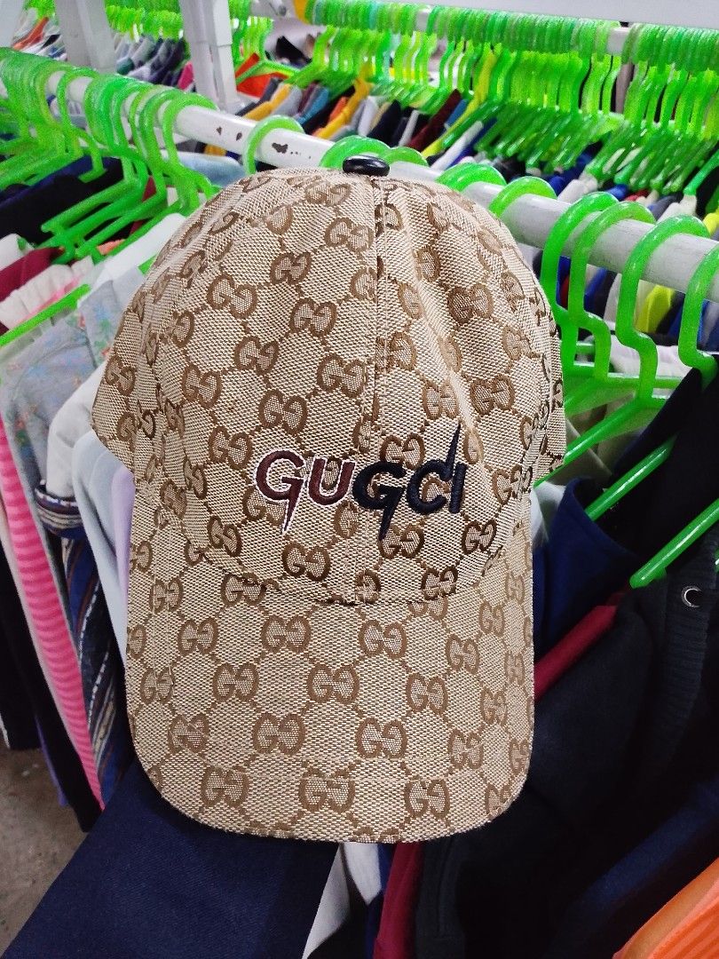 G ucc! GG Supreme Baseball Cap (Category: Caps & Hats) located in Caloocan City. Submitted by mayn_della (Listing ID 1469249976, Image 1). Description: - Authentic Gucci GG monogram canvas cap in beige and brown - Features embroidered Gucci logo on the front - Made in Italy (90% merino wool, 10% cashmere blend) - Comfortable brown interior lining with woven Gucci text - Adjustable black leather strap with branded metal hardware for a custom fit.