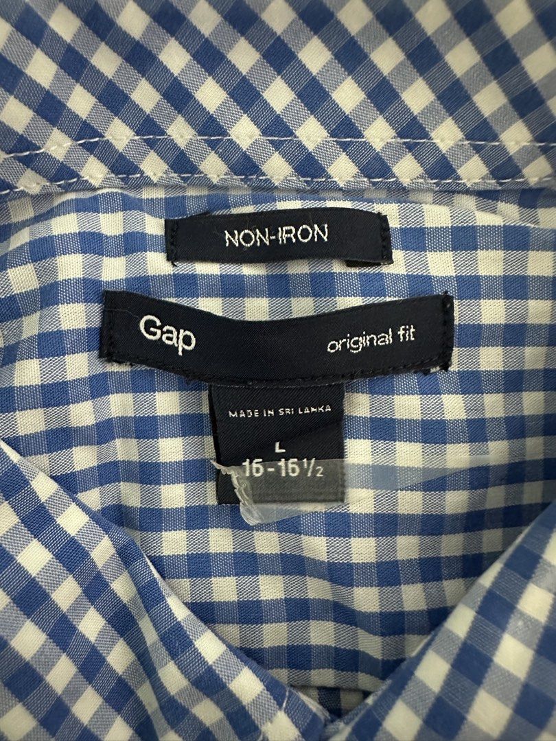 Gap Blue Gingham Non-Iron Button-Down Shirt (Category: Formal Shirts) located in Quezon City. Submitted by aussomefinds (Listing ID 1469250329, Image 2). Description: - Brand: Gap - Style: Blue and white gingham button-down shirt - Size: Large (Neck: 16-16.5) - Fit: Original fit - Fabric: Non-iron finish for low-maintenance care - Details: Long sleeves with button cuffs, standard collar - Origin: Made in Sri Lanka - Versatility: Perfect for both 
