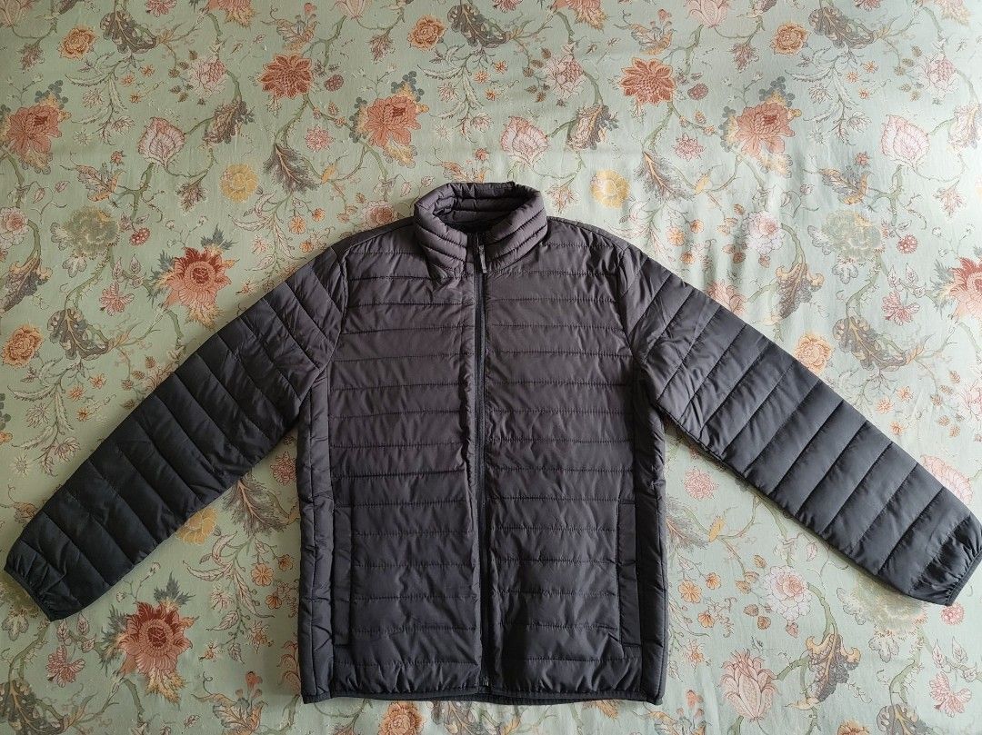 Gap Puffer Jacket (Category: Coats, Jackets and Outerwear) located in Kajang. Submitted by utaniaplants (Listing ID 1469199817, Image 2). Description: - Never used - Color: outside-Dark grey ; inside-Black - Design: All-over quilted pattern with full front zipper and high collar - Pockets: Two spacious side pockets for keys or phone - Comfort: Lightweight warmth, perfect for layering over sweaters - Condition: New & never used, clean inside and o