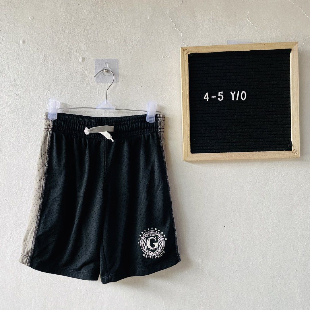 GapKids Varsity Athletic Mesh Shorts (Category: Babies & Kids Fashion) located in Caloocan City. Submitted by lovemyclothes21 (Listing ID 1469271810, Image 1). Description: - Brand: GapKids - Size: XS (fits ages 4-5 years old) - Color: Black with grey side panels and white drawstring - Design: Varsity Athletic graphic print near the hem - Material: Breathable, lightweight fabric - Fit: Easy pull-on style with comfortable elastic waistband - Condi