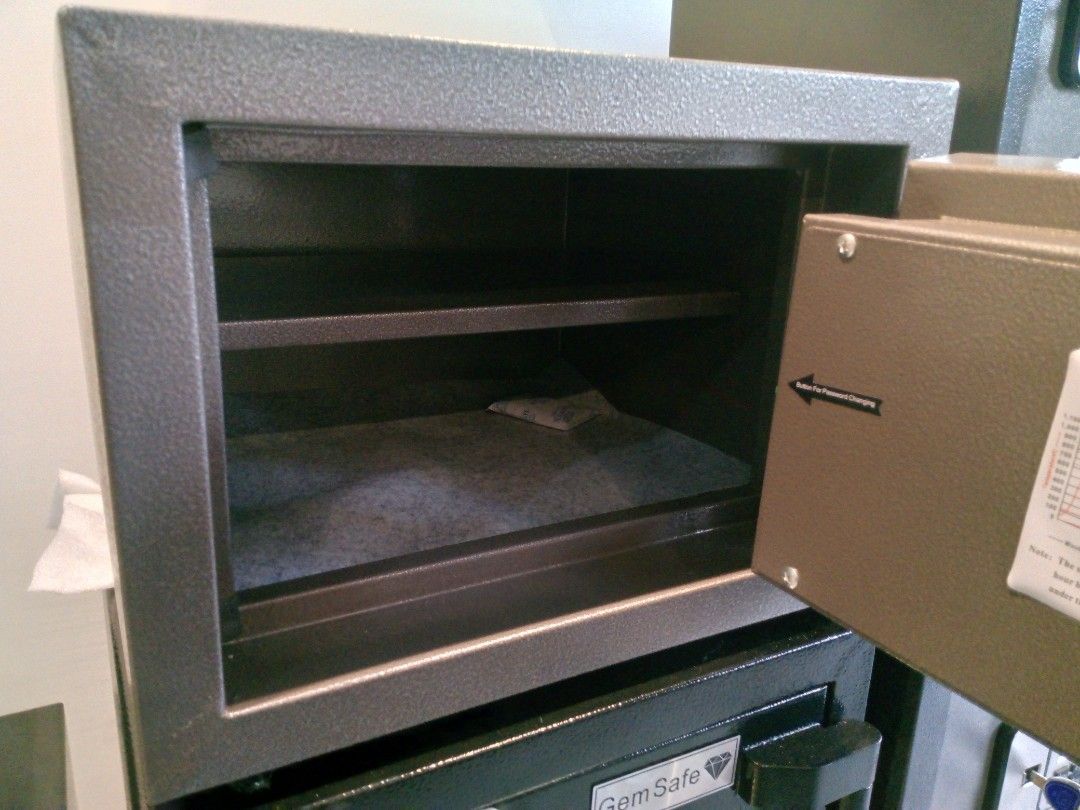 Gem Safe Digital Electronic Safe Box with Keypad (Category: Safe) located in Manila. Submitted by online_tindako (Listing ID 1469197205, Image 3). Description: - Brand/Model: Gem Safe digital security box - Color: Dark grey - Security: Digital keypad with LED display, override key lock, and two solid steel locking bolts - Interior: Clean felt lining with a removable shelf - Features: Fire resistance test label and physical keys included - Power: 