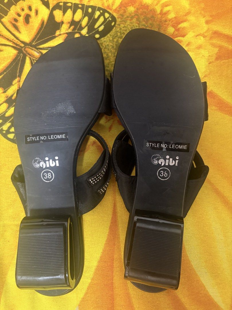 Gibi Leomie Black Heels Size 38 (Category: Heels) located in Manila. Submitted by nykji96 (Listing ID 1469179411, Image 2). Description: - Brand: Gibi Leomie - Color: Black - Size: 38 - Heel Type: Stable block heels - Details: Rhinestone-studded strap details across the top and front - Condition: Brand new, unworn, and properly stored - Features: Clean insoles with Gibi logo and clearly stamped outsoles.