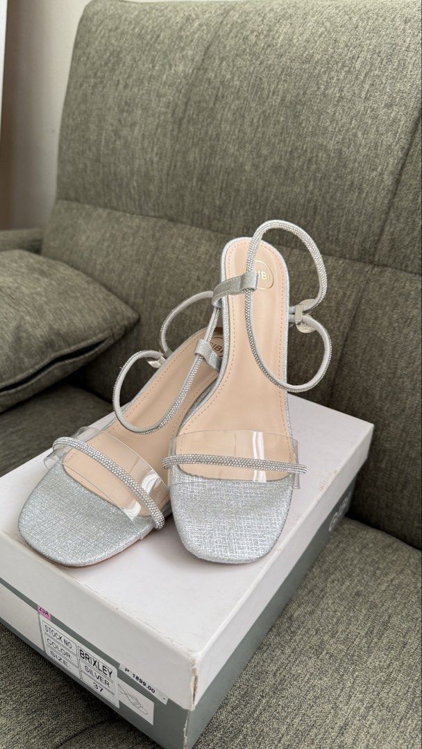 Gibi Silver Heels Size 37 (Category: Heels) located in Makati City. Submitted by angel.ad (Listing ID 1469162463, Image 2). Description: Gibi size 37 Silver formal shoes Block heel Adjustable strap Used once Good condition, like new.