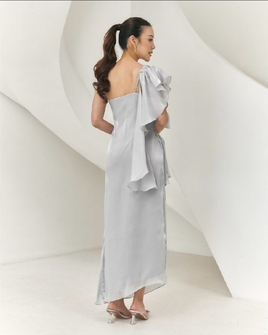 GIEA Asymmetrical Eos Dress Teal Blue (Category: Dresses) located in San Mateo. Submitted by reyshel08 (Listing ID 1469317403, Image 2). Description: - Brand: GIEA - Style: Asymmetrical Eos Dress - Color: Teal Blue - Design: One-shoulder with flowing ruffle detail and subtle fabric texture - Length: Midi length - Fit: Structured silhouette - Available Sizes: S, M, L - Condition: Brand New - Mode of Payment: GCash, BPI, or Bank Transfer - Shipping