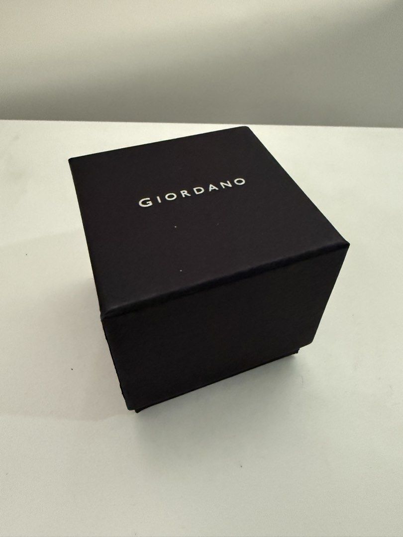 GIORDANO Men's Analog Watch with Box (Category: Men's Watches) located in Quezon City. Submitted by bravehorse_f1f6d5 (Listing ID 1469275049, Image 3). Description: - Brand: GIORDANO - Dial: Sleek black with elegant gold numbering - Strap: Stainless steel, still wrapped in original protective plastic - Inclusions: Original branded box and tags included - Perfect for daily wear or as a ready-to-give gift.