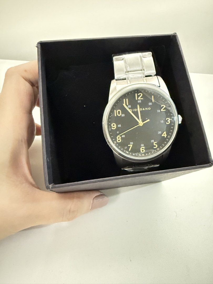 GIORDANO Men's Analog Watch with Box (Category: Men's Watches) located in Quezon City. Submitted by bravehorse_f1f6d5 (Listing ID 1469275049, Image 2). Description: - Brand: GIORDANO - Dial: Sleek black with elegant gold numbering - Strap: Stainless steel, still wrapped in original protective plastic - Inclusions: Original branded box and tags included - Perfect for daily wear or as a ready-to-give gift.