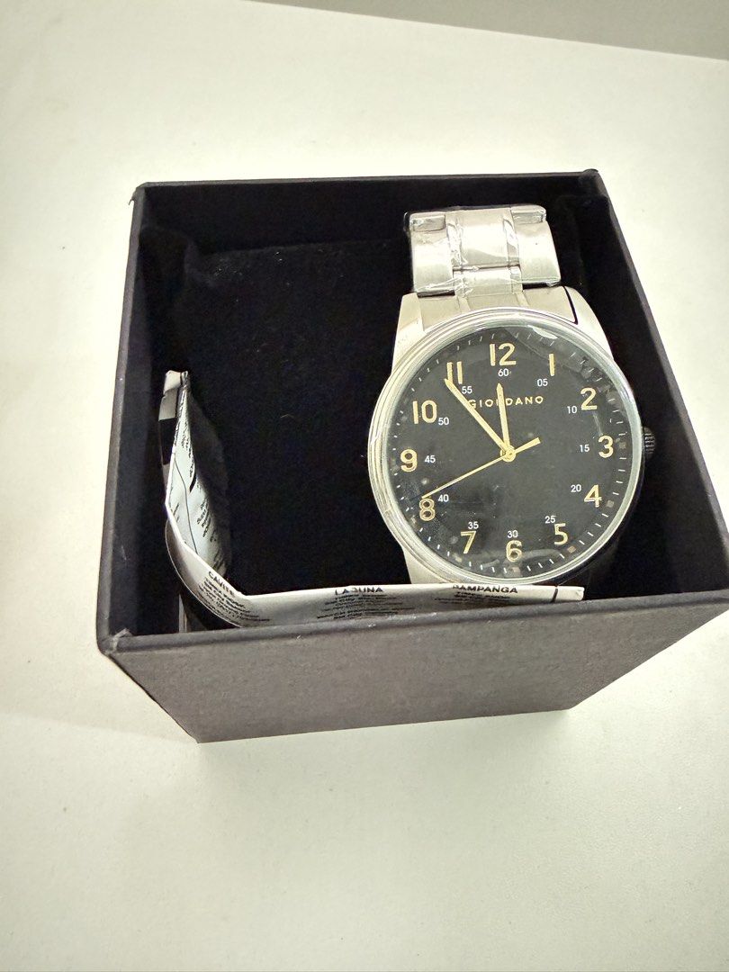 GIORDANO Men's Analog Watch with Box (Category: Men's Watches) located in Quezon City. Submitted by bravehorse_f1f6d5 (Listing ID 1469275049, Image 1). Description: - Brand: GIORDANO - Dial: Sleek black with elegant gold numbering - Strap: Stainless steel, still wrapped in original protective plastic - Inclusions: Original branded box and tags included - Perfect for daily wear or as a ready-to-give gift.
