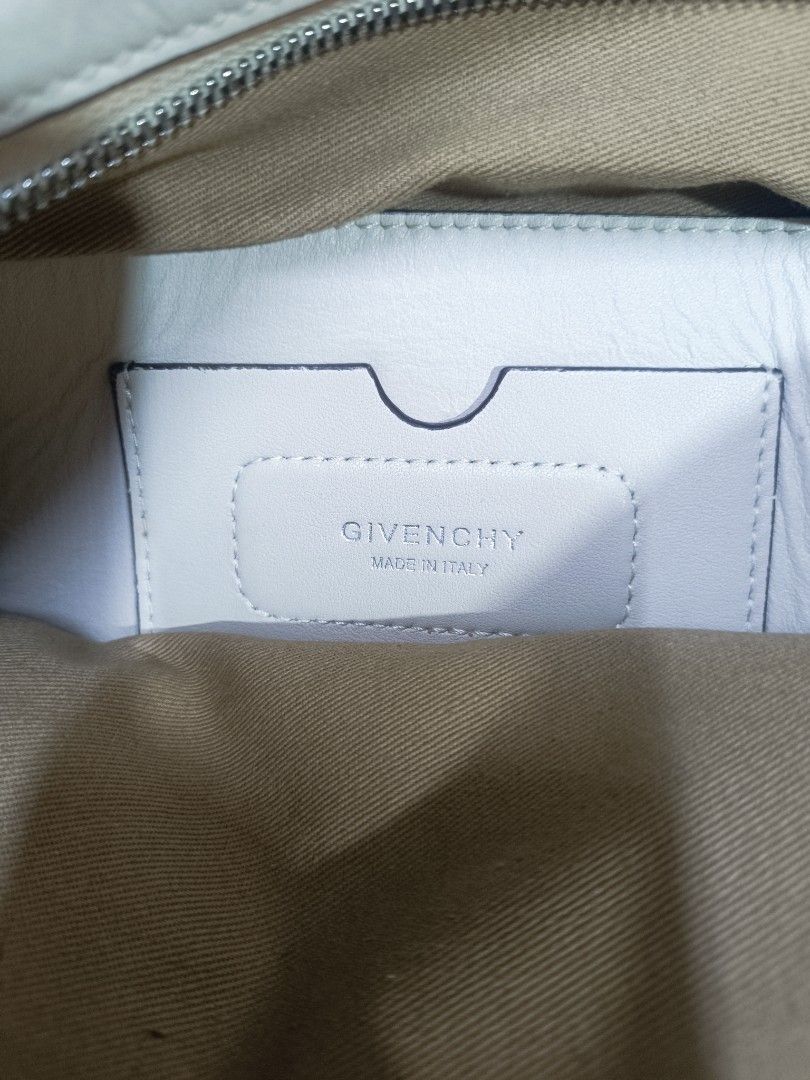 Givenchy Antigona White Leather Handbag (Category: Luxury Bags & Wallets) located in Pateros City. Submitted by harry062182 (Listing ID 1469198579, Image 2). Description: - Brand: Givenchy Antigona Satchel - Color: Classic White in smooth leather - Hardware: Silver-tone with top zip closure - Interior: Clean fabric lining with embossed 'Made in Italy' leather patch and serial number tag (GF 0271) - Strap: Includes adjustable and detachable matchi
