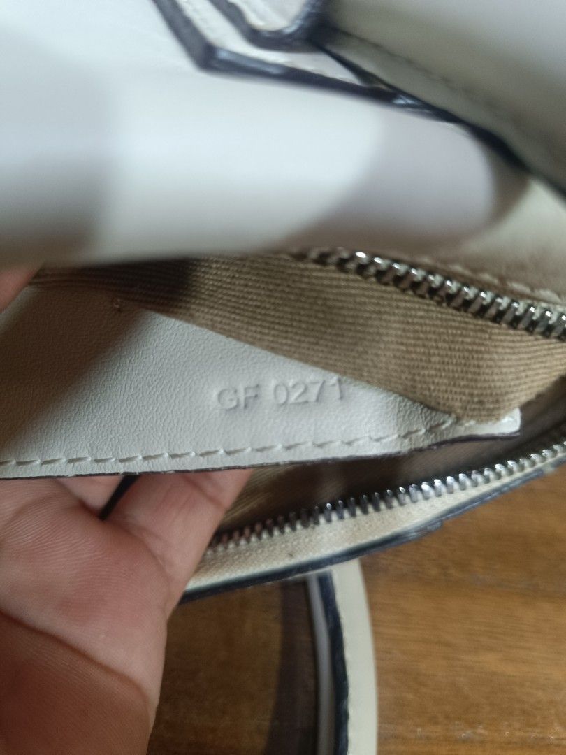 Givenchy Antigona White Leather Handbag (Category: Luxury Bags & Wallets) located in Pateros City. Submitted by harry062182 (Listing ID 1469198579, Image 3). Description: - Brand: Givenchy Antigona Satchel - Color: Classic White in smooth leather - Hardware: Silver-tone with top zip closure - Interior: Clean fabric lining with embossed 'Made in Italy' leather patch and serial number tag (GF 0271) - Strap: Includes adjustable and detachable matchi