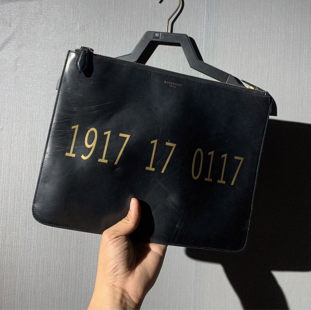 givenchy clutch/ pouch (Category: Luxury Bags & Wallets) located in Bacolod City. Submitted by garagehunterbuyandsale (Listing ID 1469309376, Image 2). Description: Givenchy 1917 Printed Leather Pouch in Black issue scratchesss take a look before u buy.