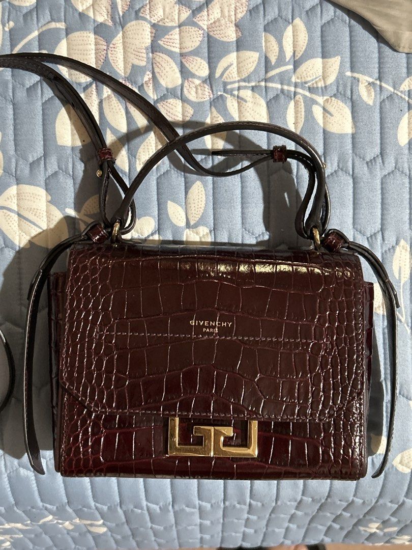 Givenchy Eden Crocodile-Embossed Leather Bag (Category: Luxury Bags & Wallets) located in Alitagtag. Submitted by patrickvillanueva (Listing ID 1469207176, Image 1). Description: Givenchy Eden Crocodile-Embossed Leather Bag - Brand: Givenchy Paris - Style: Crossbody bag / Structured flap design - Material: Rich burgundy crocodile embossed leather with glossy finish - Hardware: Signature gold-tone lock closure - Strap: Matching adjustable leather 
