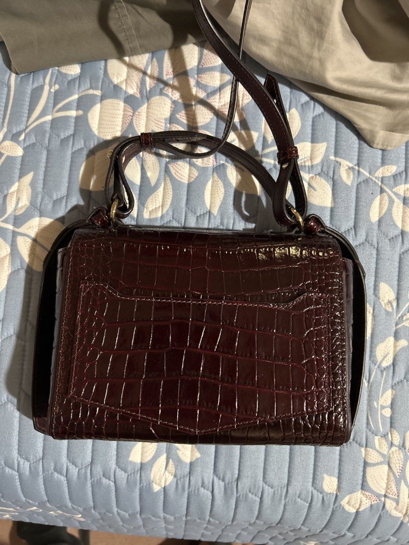 Givenchy Eden Crocodile-Embossed Leather Bag (Category: Luxury Bags & Wallets) located in Alitagtag. Submitted by patrickvillanueva (Listing ID 1469207176, Image 3). Description: Givenchy Eden Crocodile-Embossed Leather Bag - Brand: Givenchy Paris - Style: Crossbody bag / Structured flap design - Material: Rich burgundy crocodile embossed leather with glossy finish - Hardware: Signature gold-tone lock closure - Strap: Matching adjustable leather 