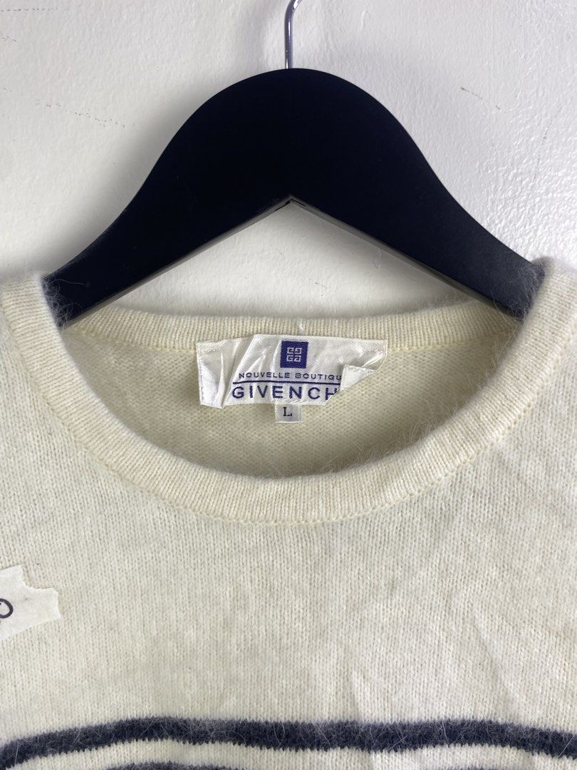 Givenchy Striped Knit Sweater with Logo Buttons (Category: Longsleeves) located in Manila. Submitted by declutterpromax (Listing ID 1469201973, Image 2). Description: - Brand: Givenchy - Color: White with black stripes - Details: Glossy black buttons with gold geometric logo accents - Material: Soft knit fabric - Design: Long sleeve, clean minimalist styling - Condition: Excellent pre-loved condition - Location: Metro Manila, Philippines - Shippi