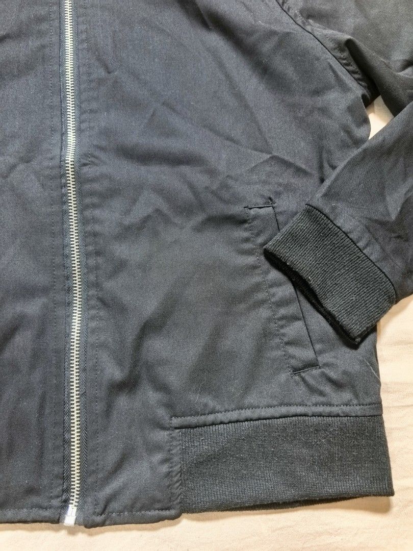 Gladys Black Bomber Jacket (Category: Coats, Jackets and Outerwear) located in Tacloban City. Submitted by thead.declutters (Listing ID 1469215962, Image 2). Description: - Style: Gladys black bomber jacket - Closure: Full front zip - Details: Ribbed collar, cuffs, and hem with two front welt pockets - Fabric: Lightweight material, perfect for layering over tees or hoodies - Fit: Chest measures roughly 20 inches across.