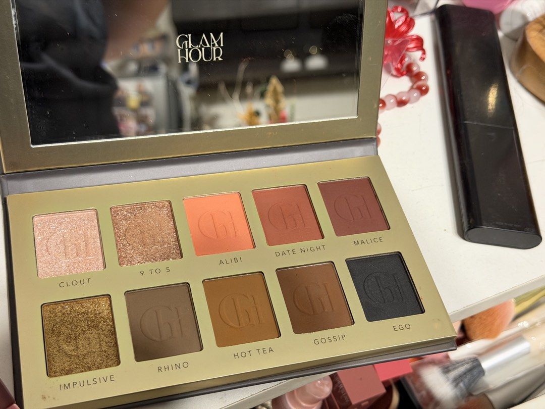 Glam Hour Eyeshadow Palette (Category: Makeup) located in Valenzuela. Submitted by ashellay (Listing ID 1469350112, Image 2). Description: - Brand: Glam Hour - 10 gorgeous shades: Clout, 9 to 5, Alibi, Date Night, Malice, Impulsive, Rhino, Hot Tea, Gossip, and Ego - Mix of highly pigmented matte and shimmer finishes - Great range of neutrals, warm tones, and bold colors for everyday or evening looks - Convenient built-in mirror inside the lid - E