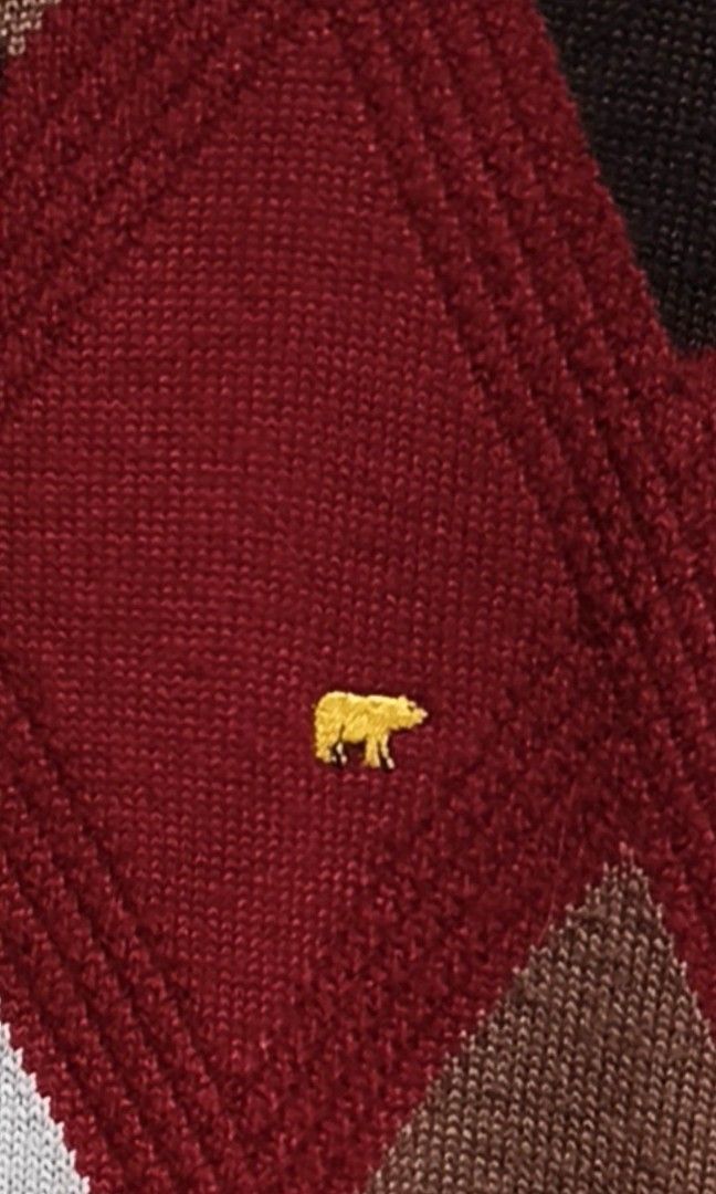 Golden Bear Argyle Knit Sweater Red (Category: Longsleeves) located in Makati City. Submitted by thriftersmakati (Listing ID 1469364158, Image 3). Description: - Brand: Golden Bear - Color: Dark red with white, brown, and dark brown argyle pattern - Details: Small embroidered gold bear logo on the chest - Fit: Relaxed fit with ribbed crew neck, cuffs, and hem - Material: Warm acrylic/wool blend fabric - Condition: Excellent pre-loved condition.