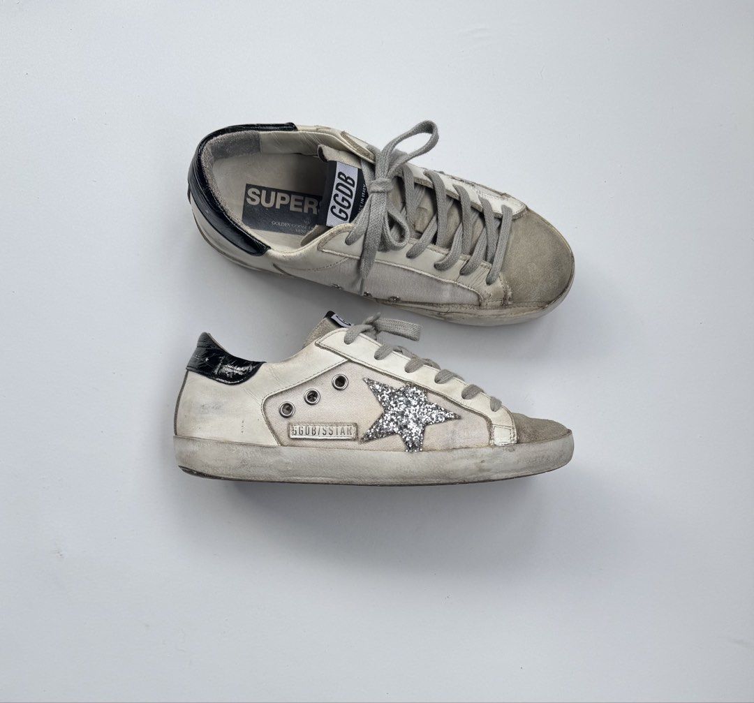 Golden Goose Superstar Sneakers (Category: Sneakers) located in Davao. Submitted by LUXURY (Listing ID 1462991767, Image 1). Description: Golden Goose Superstar sneakers in cream with glitter star. Black heel tab. Shows minor signs of wear on soles/uppers but plenty of life left. Size 36 Pair only Visit my profile for more luxury items .