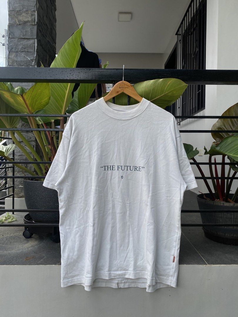 GOOPIMADE "The Future" Softbox Graphic Tee White (Category: Tshirts & Polo Shirts ) located in Roxas City. Submitted by dua-garments23 (Listing ID 1469206837, Image 1). Description: - Brand: GOOPIMADE (Softbox Series) - Color: White - Material: 100% thick, premium cotton - Fit: Relaxed boxy fit with a thick ribbed collar - Design: 'The Future' text on front; large abstract graphic and Japanese text printed down the back spine - Details: Interior 