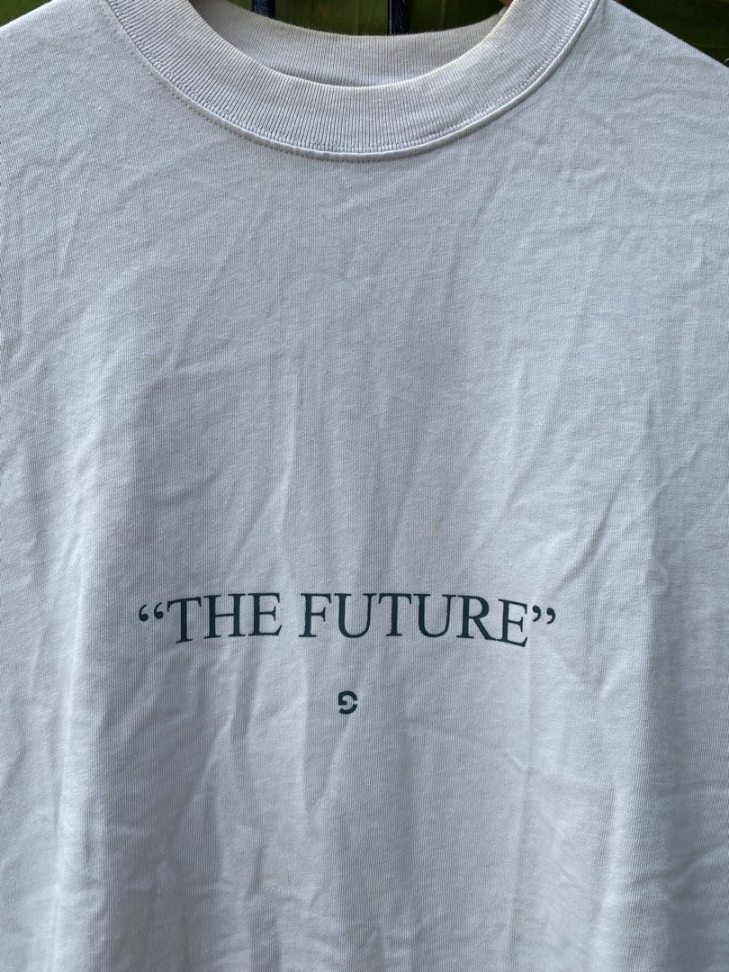 GOOPIMADE "The Future" Softbox Graphic Tee White (Category: Tshirts & Polo Shirts ) located in Roxas City. Submitted by dua-garments23 (Listing ID 1469206837, Image 2). Description: - Brand: GOOPIMADE (Softbox Series) - Color: White - Material: 100% thick, premium cotton - Fit: Relaxed boxy fit with a thick ribbed collar - Design: 'The Future' text on front; large abstract graphic and Japanese text printed down the back spine - Details: Interior 