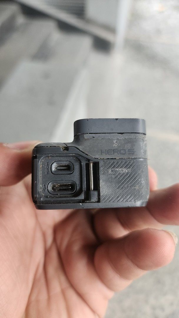 GoPro Hero 5 Black Action Camera (Category: Cameras) located in Manila. Submitted by karlmark132527 (Listing ID 1469165145, Image 3). Description: - Item: GoPro Hero 5 Action Camera - Condition: Used with noticeable scuffs and wear; lens and screens are intact and clean - Functionality: Tested and powers on successfully - Features: USB-C and HDMI ports with side door panel attached - Ideal for: Biking, surfing, travel vlogs, and rugged outdoor sh