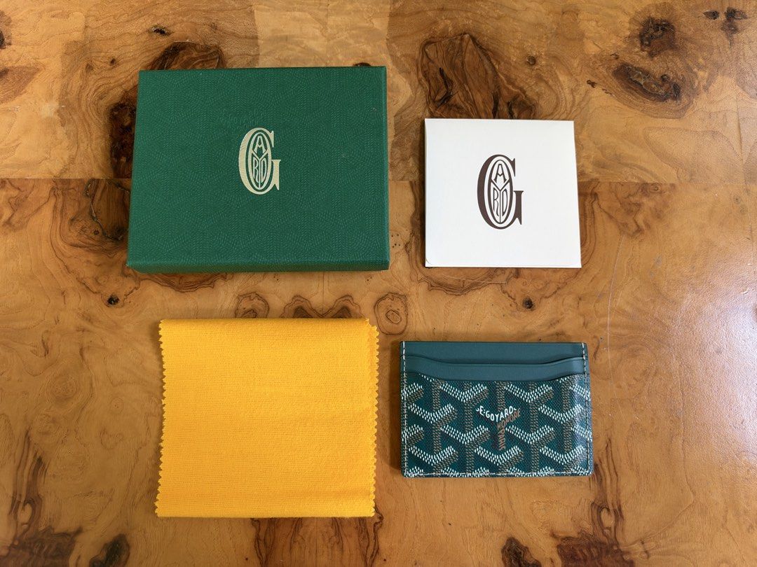 Goyard Saint Sulpice Card Holder Green (Category: Luxury Bags & Wallets) located in Muntinlupa City. Submitted by katoshops (Listing ID 1469199269, Image 3). Description: - Authentic Goyard card holder in striking green chevron canvas - Premium leather lining with multiple card slots on both sides and a convenient center pocket - Condition: Excellent (10/10) - Barely used - Includes complete inclusions: original green box, yellow dust cloth, and 