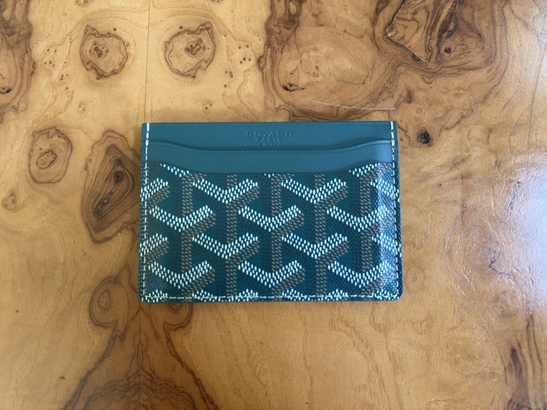 Goyard Saint Sulpice Card Holder Green (Category: Luxury Bags & Wallets) located in Muntinlupa City. Submitted by katoshops (Listing ID 1469199269, Image 1). Description: - Authentic Goyard card holder in striking green chevron canvas - Premium leather lining with multiple card slots on both sides and a convenient center pocket - Condition: Excellent (10/10) - Barely used - Includes complete inclusions: original green box, yellow dust cloth, and 