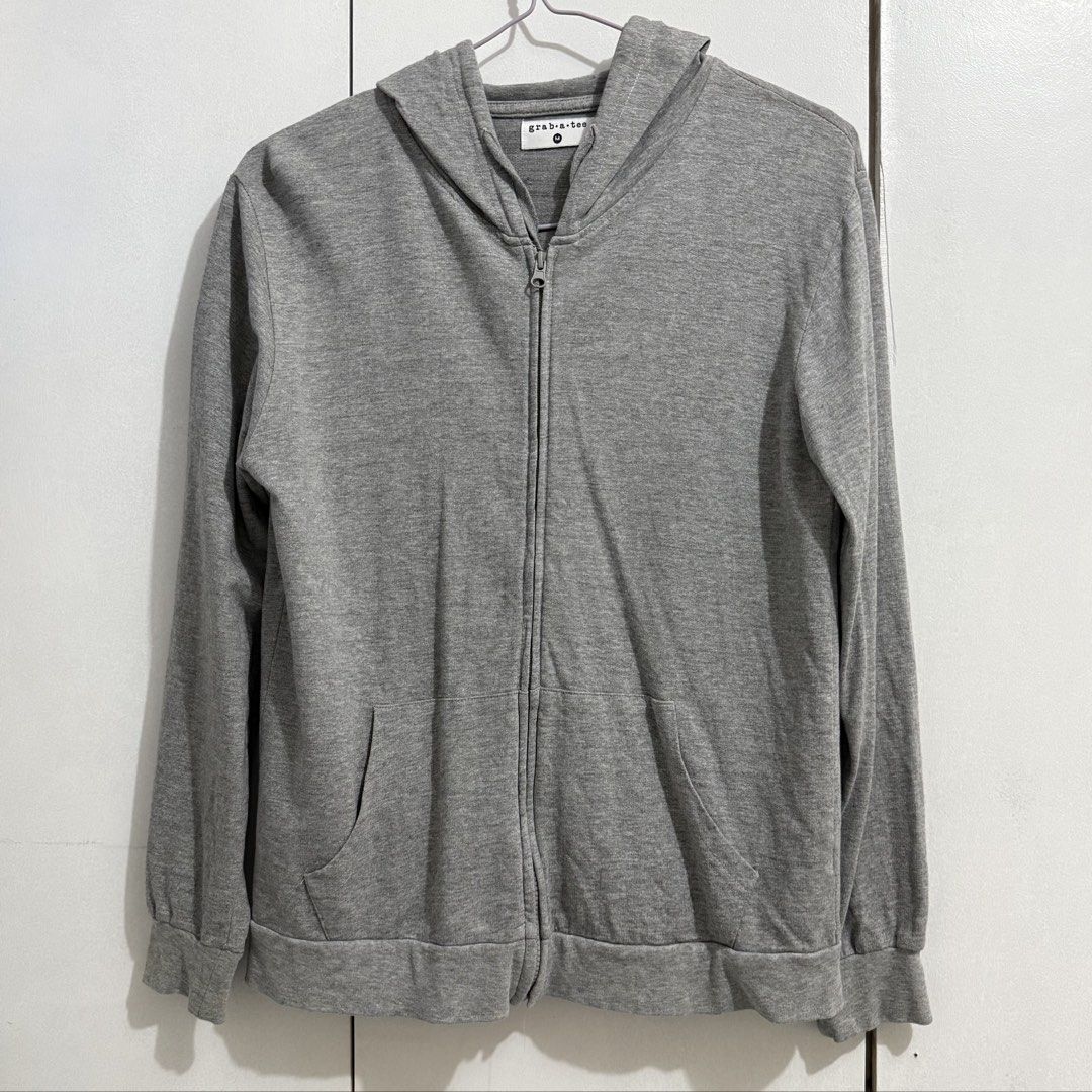 Grab-a-tee Jacket/Hoodie (Category: Coats, Jackets and Outerwear) located in Cagayan de Oro. Submitted by bfiona (Listing ID 1469309538, Image 1). Description: Good as new Very comfy Best fit for M frames (tama lang yung pagka oversize niya).