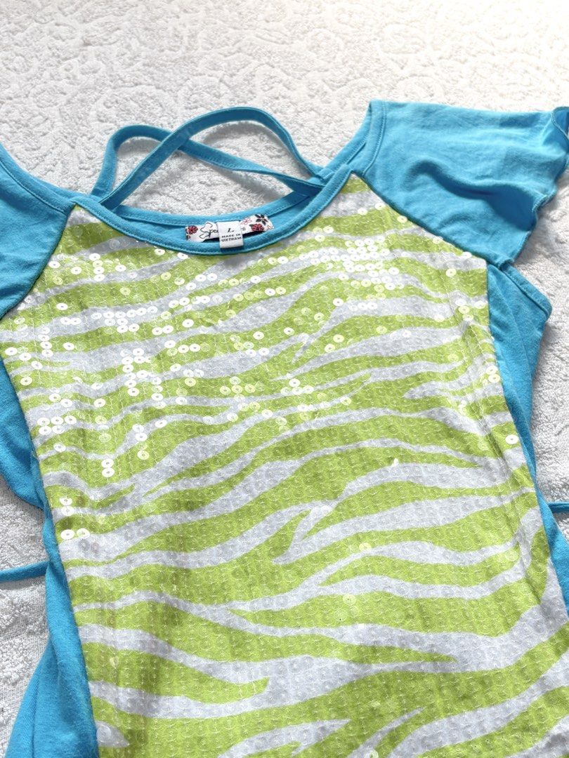 Green White Zebra Sequin Blue Top (Category: Blouses) located in Butuan. Submitted by saloreia (Listing ID 1469291100, Image 2). Description: ── ⟡ ˙💌 ̟ y2k blue zebra top w/ side ties ‧₊˚ ⋅ playful zebra print with a lace-up silhouette ‧₊˚ ⋅ ┆ ⤿ brand : Speechless ┆ ⤿ size : xs-s 🪷 condition .ᐟ: 10/10 🪷 seller’s fave!! .