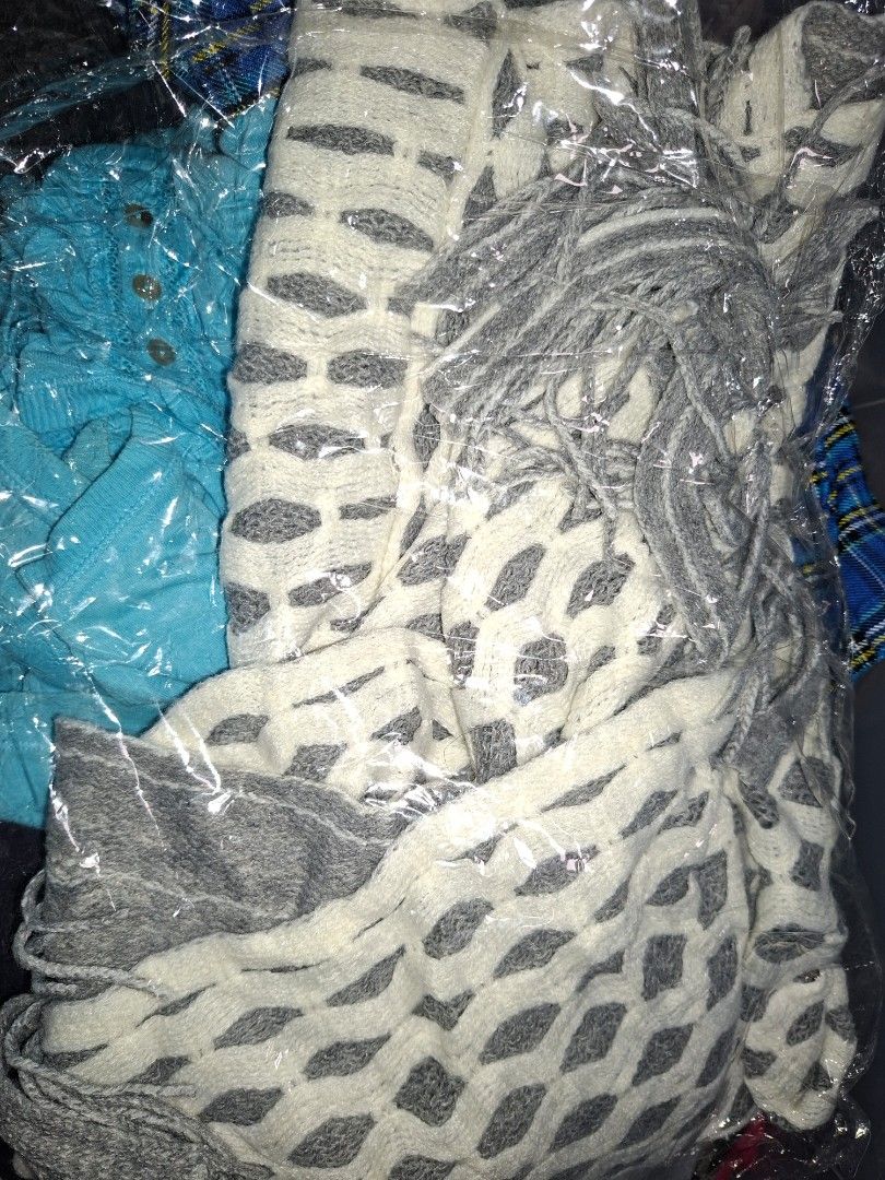 Grey and white patterned shawl with fringe (Category: Scarves) located in Manila. Submitted by mialiurshop (Listing ID 1469227070, Image 2). Description: - Color & Design: Grey and white with an all-over diamond pattern - Details: Chic fringe along the edges - Material: Cozy, warm fabric ideal for cooler weather - Versatility: Easy to drape over shoulders or wear as a scarf - Condition: Kept neatly folded in protective plastic wrapping - Size: St