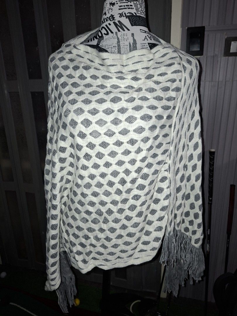 Grey and white patterned shawl with fringe (Category: Scarves) located in Manila. Submitted by mialiurshop (Listing ID 1469227070, Image 1). Description: - Color & Design: Grey and white with an all-over diamond pattern - Details: Chic fringe along the edges - Material: Cozy, warm fabric ideal for cooler weather - Versatility: Easy to drape over shoulders or wear as a scarf - Condition: Kept neatly folded in protective plastic wrapping - Size: St