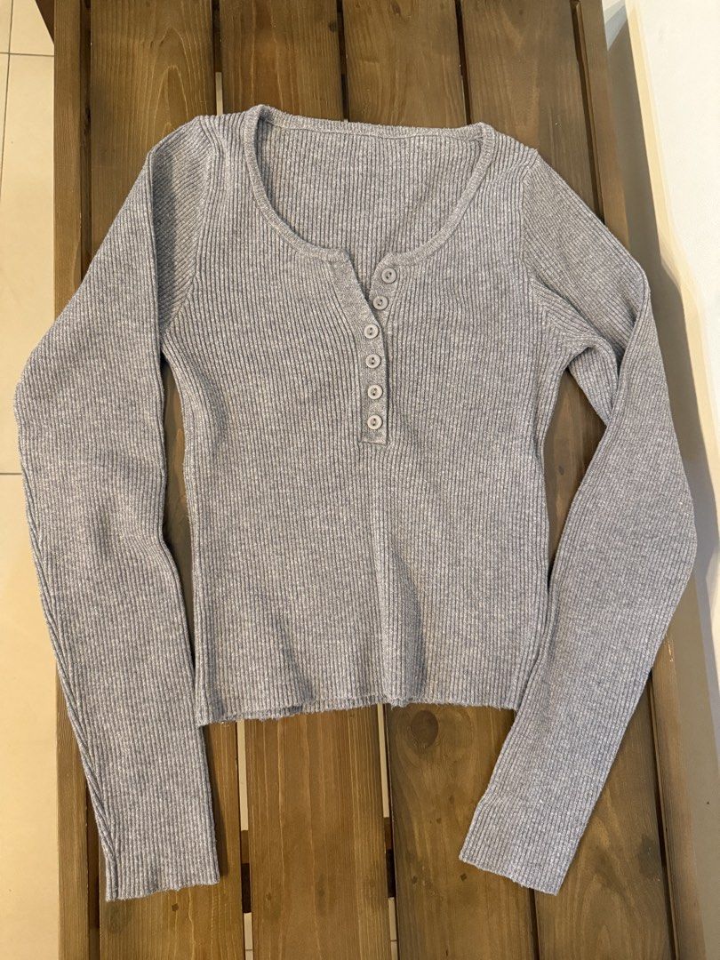 Grey ribbed long sleeve button-up top (Category: Longsleeves) located in Antipolo. Submitted by aiyecandl (Listing ID 1469307955, Image 1). Description: - Brand: No brand, but I bought during my trip to Korea - Color: Grey - Material: Stretchy ribbed knit - Design: Long sleeves, scoop neckline, functional front buttons - Fit: Fitted cut - Condition: Excellent, clean with no flaws.
