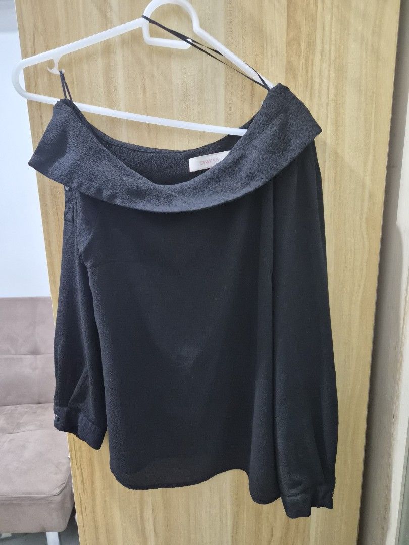 GTWFAB Black Off-Shoulder Long Sleeve Blouse (Category: Longsleeves) located in Mandaluyong City. Submitted by joyce1593 (Listing ID 1469255177, Image 2). Description: - Brand: GTWFAB - Style: Black off-shoulder top with folded collar - Sleeves: Long sleeves with elastic cuffs - Features: Lightweight fabric, thin inner straps for secure wear/hanging - Occasion: Great for casual wear or dressing up - Condition/Size: Standard sizing tag attached.