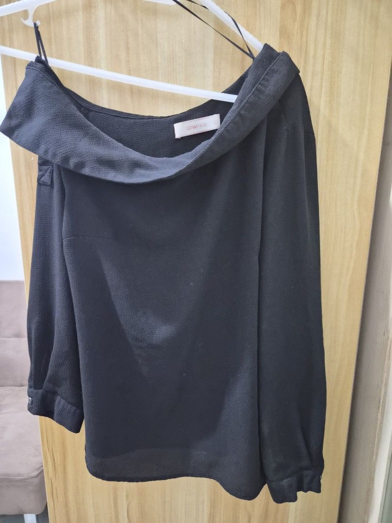 GTWFAB Black Off-Shoulder Long Sleeve Blouse (Category: Longsleeves) located in Mandaluyong City. Submitted by joyce1593 (Listing ID 1469255177, Image 1). Description: - Brand: GTWFAB - Style: Black off-shoulder top with folded collar - Sleeves: Long sleeves with elastic cuffs - Features: Lightweight fabric, thin inner straps for secure wear/hanging - Occasion: Great for casual wear or dressing up - Condition/Size: Standard sizing tag attached.
