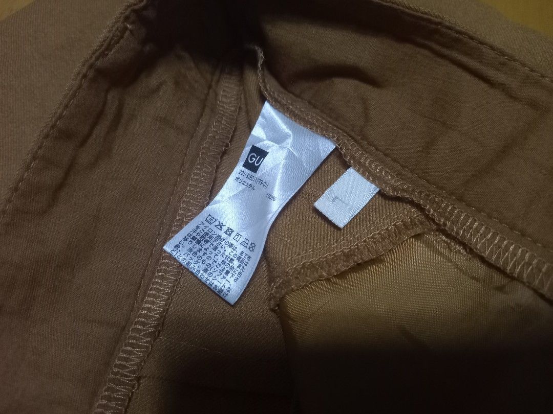 GU Brown Casual Trousers Size L (Category: Other Bottoms) located in Manila. Submitted by riaring88 (Listing ID 1469187670, Image 2). Description: best fit: W29-31 - Brand: GU - Size: L (Tag attached) - Color: Brown - Material: 100% polyester - Design: Classic waistband with belt loops, clean stitching, and simple straight-cut legs - Condition: Brand new with tags - Versatile: Great for office wear or casual outings.