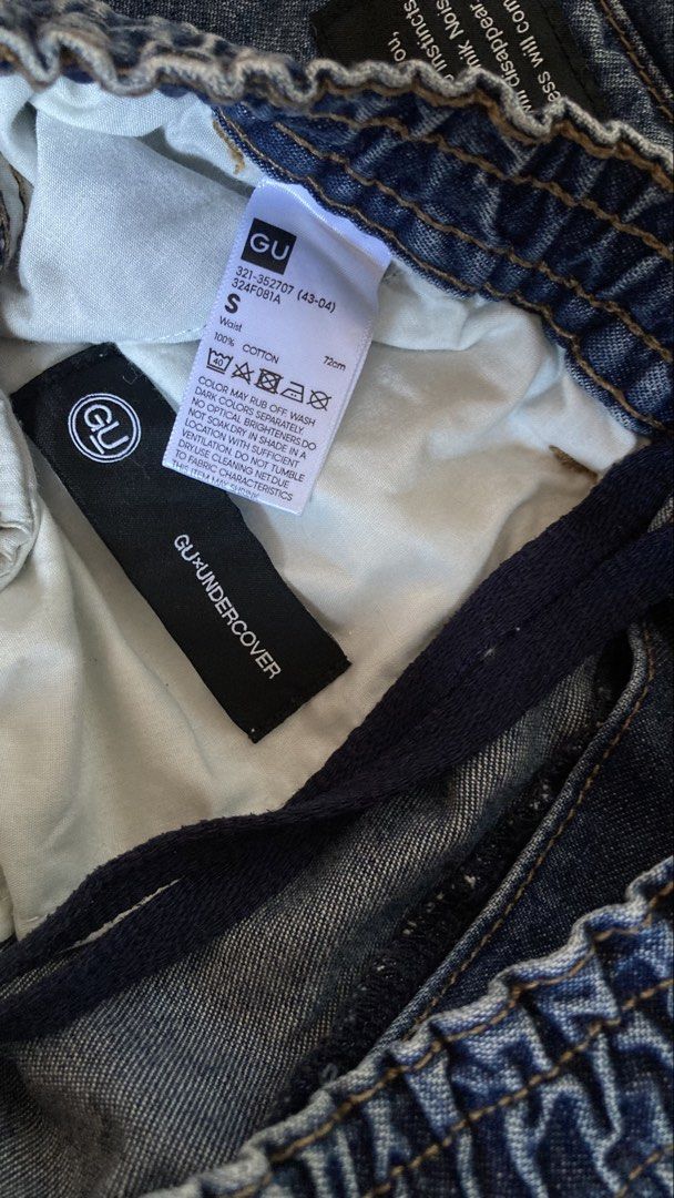 GU x UNDERCOVER Denim Cargo Pants Size S (Category: Jeans) located in Subic. Submitted by bottomjeanzgals (Listing ID 1469222236, Image 3). Description: - Brand: GU x UNDERCOVER collaboration - Style: Denim cargo pants in classic blue wash - Size: Small (Waist: 72cm) - Material: 100% premium cotton - Features: Elastic waistband with button closure, multiple utility pockets, and lower leg woven text patch - Condition: Rare collectible piece .