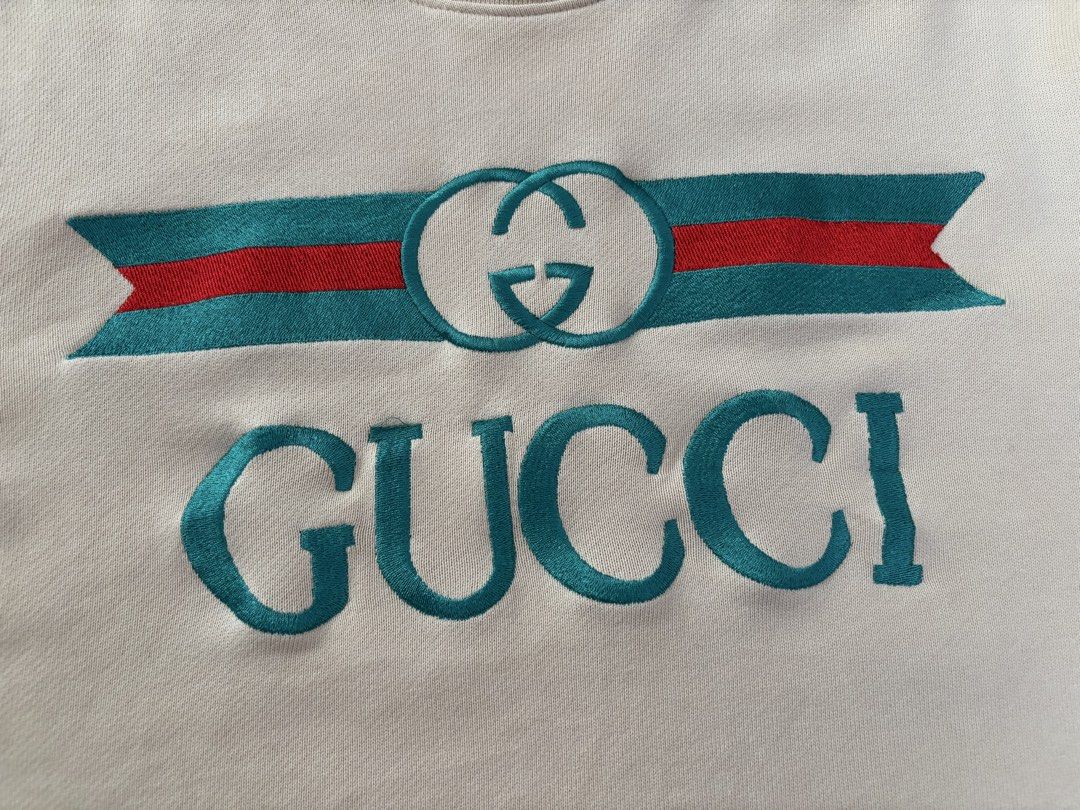 Gucci Beige Logo Sweatshirt (Category: Coats, Jackets and Outerwear) located in Makati City. Submitted by rare_thrift_stuff (Listing ID 1469164737, Image 2). Description: - Authentic Gucci Sweatshirt - Color: Beige - Material: 100% Cotton - Made in Italy - Features iconic green and red striped ribbon with interlocking G embroidery - Ribbed collar, cuffs, and hem for a snug fit - Style code: 409708-XJ064 - Clean interior with original standard car