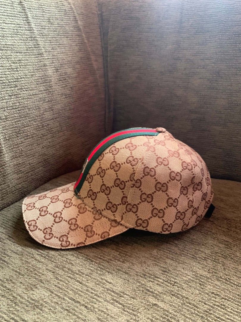 Gucci GG Supreme Baseball Cap with Web Stripe (Category: Caps & Hats) located in San Juan City. Submitted by findmorelux (Listing ID 1469226473, Image 2). Description: - Brand: Gucci - Design: Iconic GG supreme canvas with signature green-red-green web stripe - Fit: Adjustable leather strap at the back with embossed Gucci logo and gold-tone hardware - Interior: Authentic Gucci branded taping and tags - Style: Classic designer streetwear, perfect 