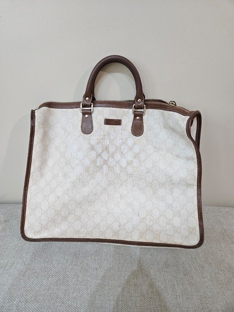 Gucci Monogram Canvas Tote Handbag Brown (Category: Luxury Bags & Wallets) located in Quezon City. Submitted by andyrms (Listing ID 1469208798, Image 1). Description: - Authentic Gucci tote bag with classic monogram canvas pattern - Premium brown leather handles and trim - Secure top zip closure - Spacious interior with fabric lining and 'Gucci Made in Italy' leather tag - Verified serial number: 189899 493025 on reverse of leather tag - Ideal ev