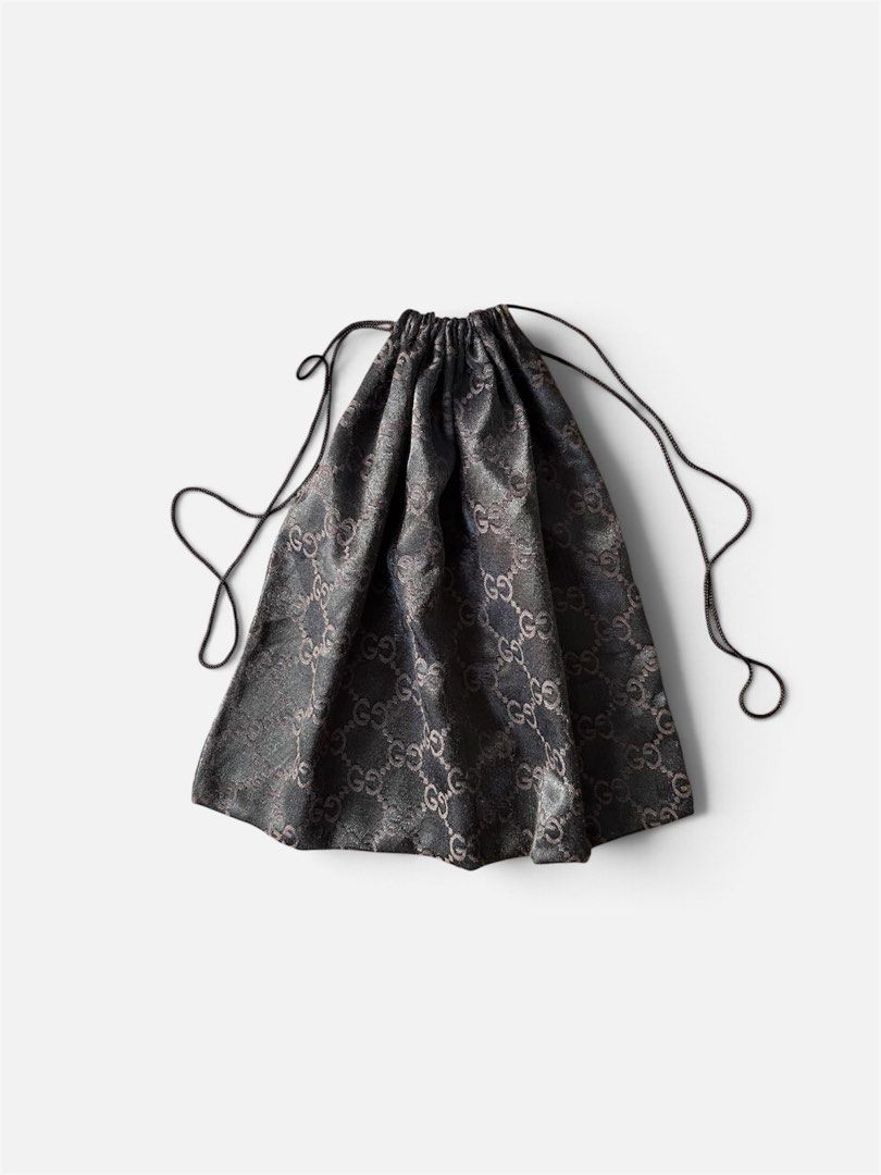 Gucci Monogram Dust Bag (Category: Announcements) located in Cebu City. Submitted by lchadpierr03463 (Listing ID 1469308710, Image 3). Description: • Material: Lustrous satin or silk-blend fabric • Pattern: Iconic interlocking GG monogram • Design: Soft pouch style with a dark drawstring top • Dimensions: Typically around 14 x 13 inches (varying slightly depending on the specific production run or bag size it accompanied Authentic .