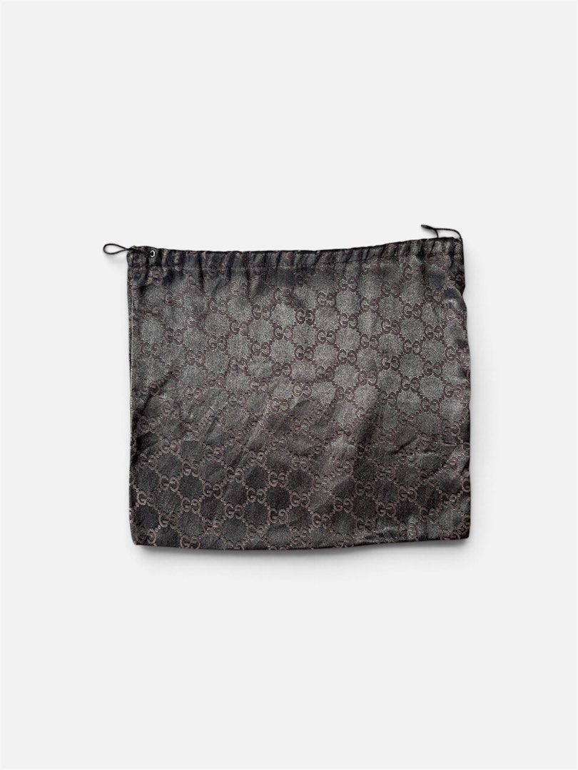 Gucci Monogram Dust Bag (Category: Announcements) located in Cebu City. Submitted by lchadpierr03463 (Listing ID 1469308710, Image 1). Description: • Material: Lustrous satin or silk-blend fabric • Pattern: Iconic interlocking GG monogram • Design: Soft pouch style with a dark drawstring top • Dimensions: Typically around 14 x 13 inches (varying slightly depending on the specific production run or bag size it accompanied Authentic .
