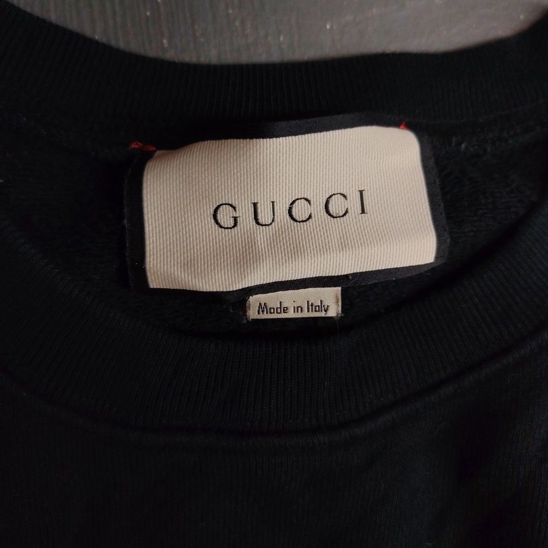 Gucci Rainbow Star Black Sweatshirt (Category: Coats, Jackets and Outerwear) located in Manila. Submitted by maetots (Listing ID 1469173994, Image 3). Description: - Brand: Gucci - Color: Black with multicolored rainbow star and logo graphic - Size: Medium - Material: 100% cotton, Made in Italy - Style: Crewneck pullover with ribbed cuffs and hem - Condition: Label tags attached inside collar.