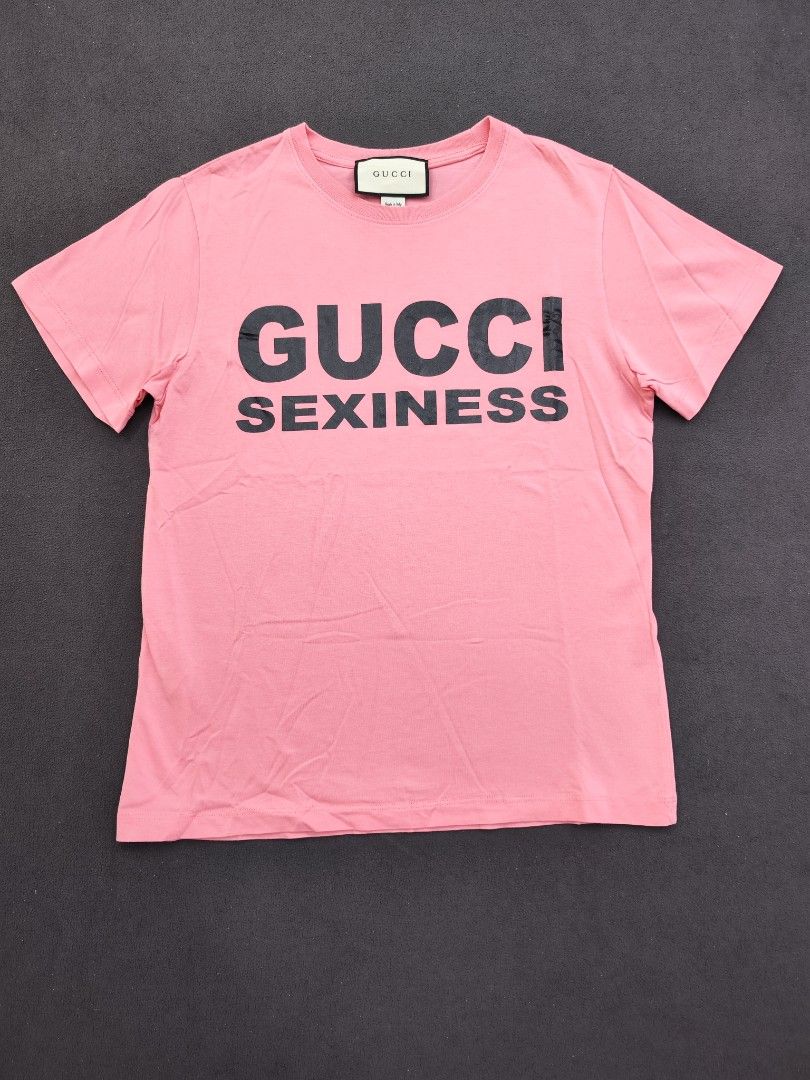 Gucci Sexiness Tee (Category: Luxury Apparel) located in Bulacan. Submitted by emilj23 (Listing ID 1469200464, Image 1). Description: Gucci Sexiness Tee Size L on tag L 25 W 18.5 Condition 9.5/10 Color rate 9.5/10 No Issue.